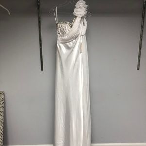One shoulder gown with embellished floral accent